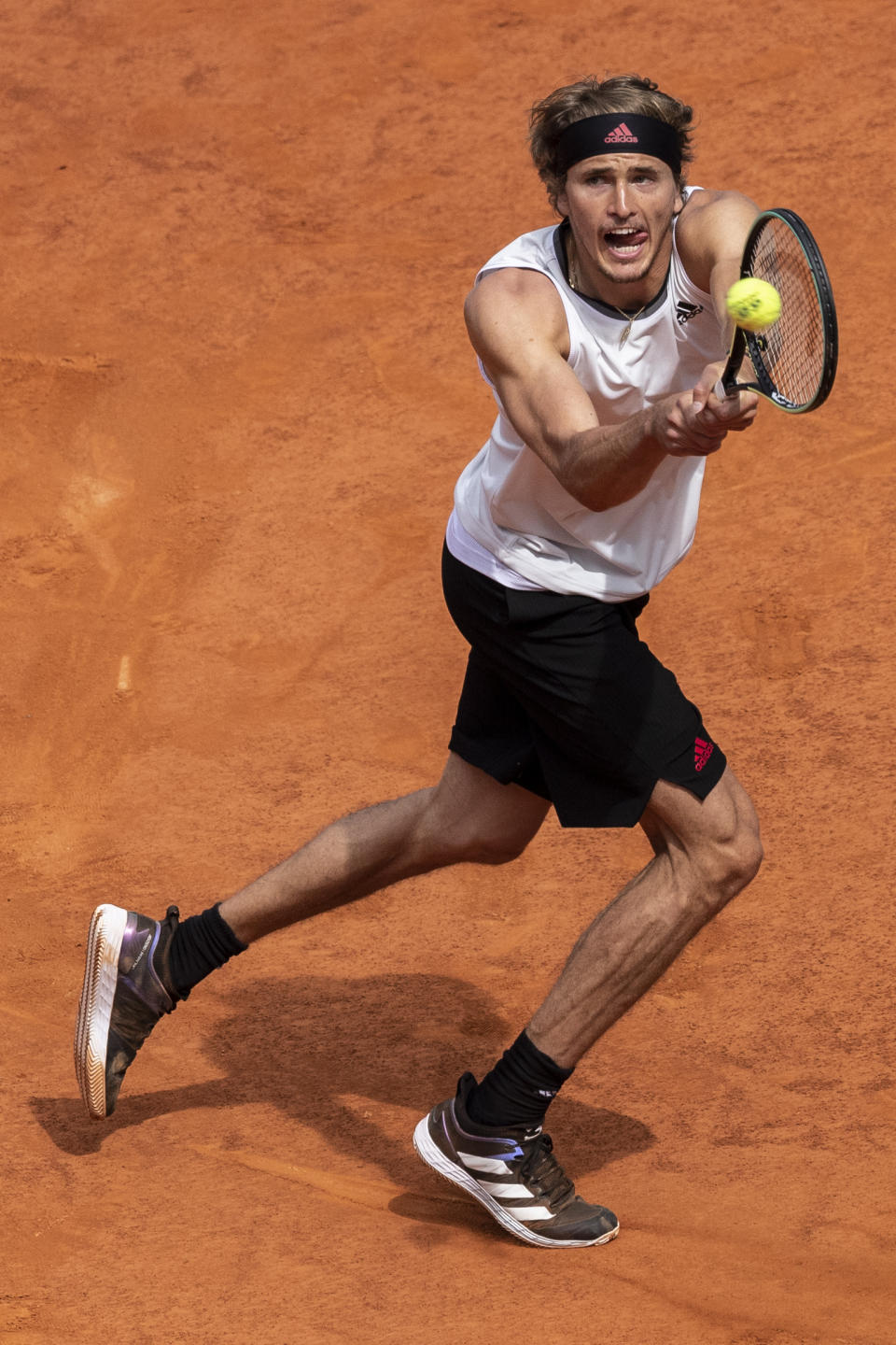 Germany's Alexander Zverev returns the ball to Austria's Dominic Thiem during their semi-final match at the Mutua Madrid Open tennis tournament in Madrid, Spain, Saturday, May 8, 2021. (AP Photo/Bernat Armangue)