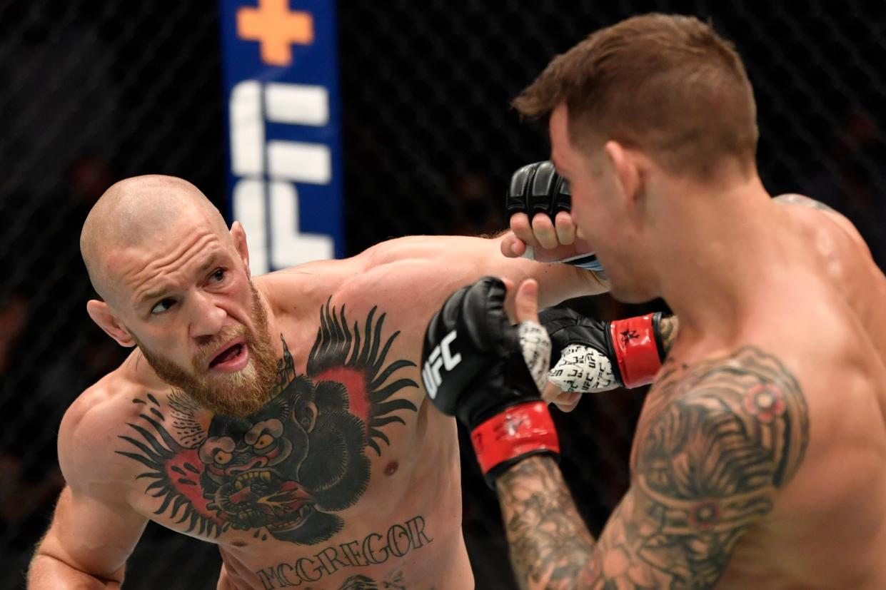 <p>Shock loss: Conor McGregor was upset by Dustin Poirier in their lightweight rematch at UFC 257</p> (Zuffa LLC via Getty Images)