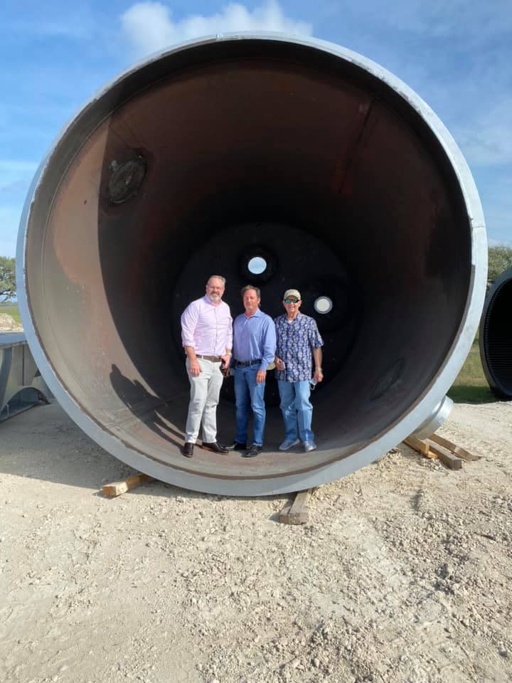 Iain Vasey, left, Rick Valls, center, and William Goldston stand inside a crucible furnance that eventually will be used at the Steel Dynamics plant near Sinton. Officials say the $1.9 billion plant is on pace to begin commissioning in mid 2021. The three men are members of the Corpus Christi Regional Economic Development Corp. and were able to tour the site Friday.