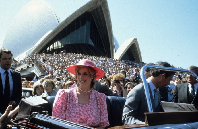 Princess Diana and Prince Charles pass by a crowd at the Sydney Opera House on March 28, 1983 - Credit: Anwar Hussein/SIPA