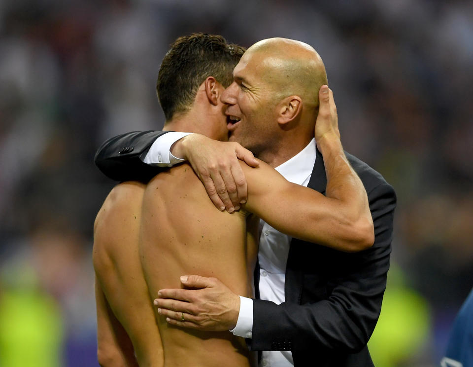 <p>With Real Madrid legend Zinedine Zidane. </p>