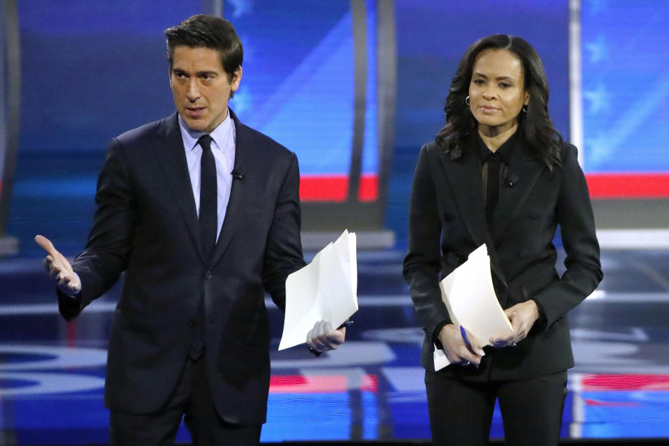 FILE - ABC World News Tonight Anchor David Muir, left, addresses members of the audience while standing with ABC News Live Anchor Linsey Davis, Friday, Feb. 7, 2020 in Manchester, N.H. The two planned presidential debates between Joe Biden and Donald Trump that were swiftly organized this week, Thursday, May 16, 2024, are good news for CNN and ABC News.(AP Photo/Elise Amendola, File)