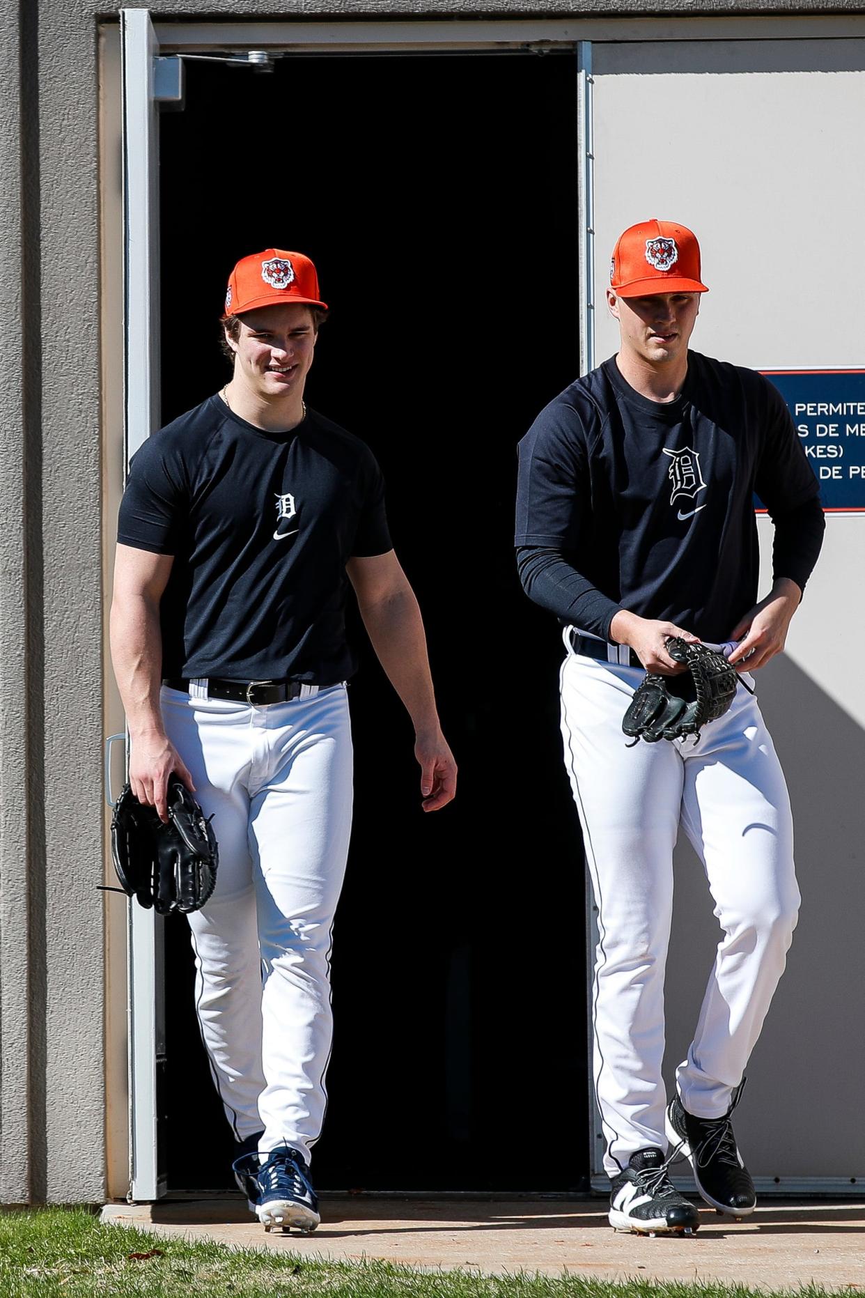 Detroit Tigers pitchers Jackson Jobe and Ty Madden walk out of the clubhouse for practice during spring training at Tigertown in Lakeland, Fla. on Wednesday, Feb. 14, 2024.