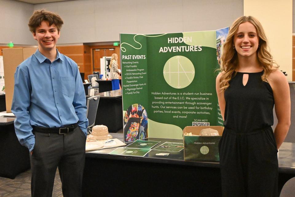 High school juniors Eli Lami of Centennial High School, left, and Anna Riley of Brentwood High School stand with their display for their business called Hidden Adventures during MTSU’s 2024 High School Entrepreneurship Fair held Tuesday, Feb. 20, in the Student Union Ballroom. The students were among the top five finalists.