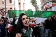 <p>An Iranian woman living in Turkey reacts during a protest following the death of Mahsa Amini, outside the Iranian consulate in Istanbul, Turkey September 21, 2022. REUTERS/Murad Sezer</p> 