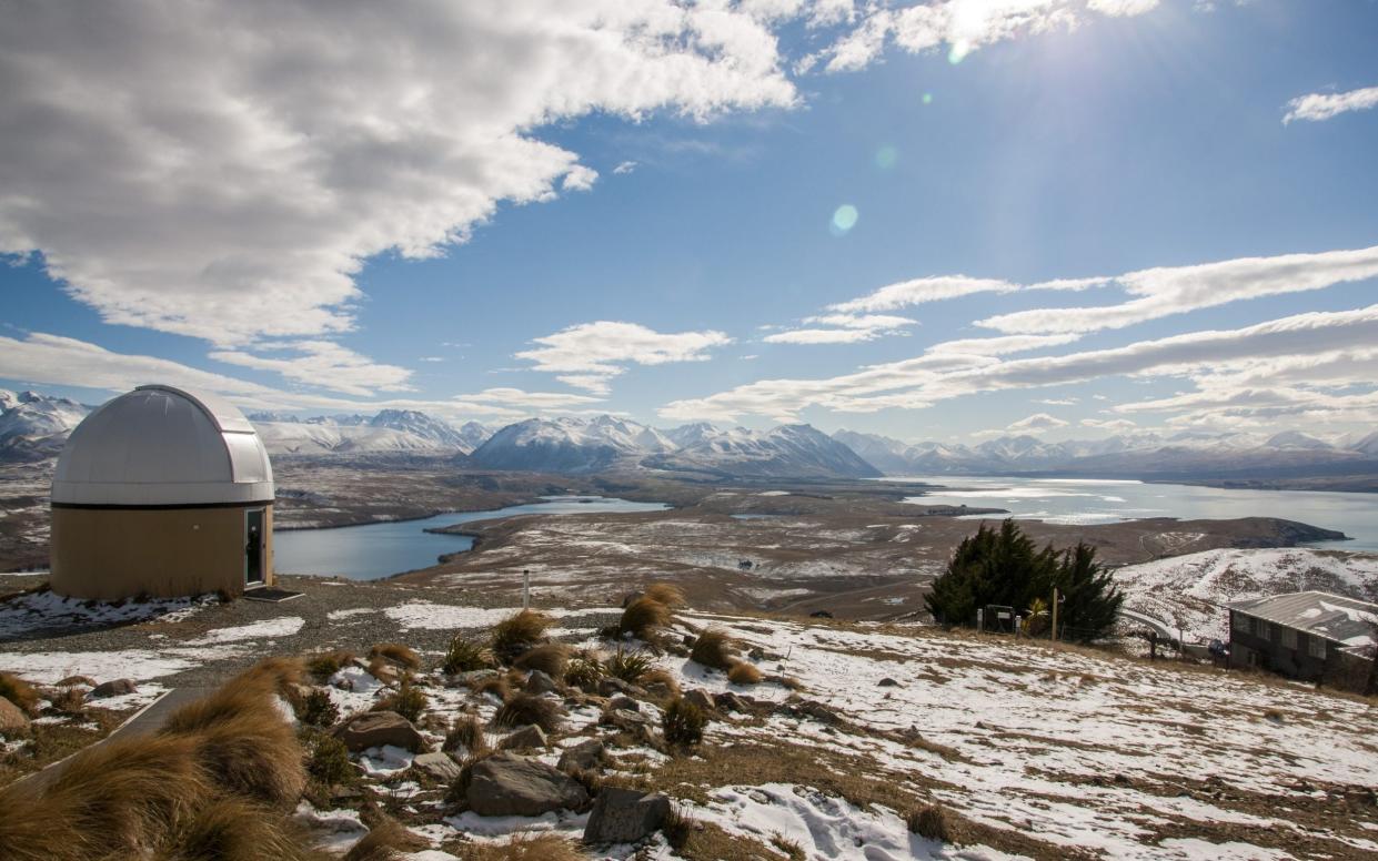 Mt St John observatory and Southern Alps in background during winter - Shutterstock