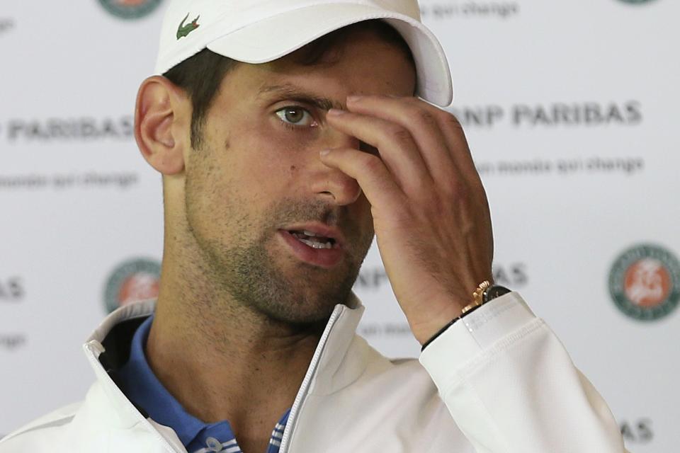 Serbia's Novak Djokovic answers reporters after losing to Austria's Dominic Thiem in a quarterfinal match of the French Open