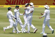 South Africa celebrate the wicket of England's Alistair Cook (not in picture) during the second cricket test match in Cape Town, South Africa, January 2, 2016. REUTERS/Mike Hutchings