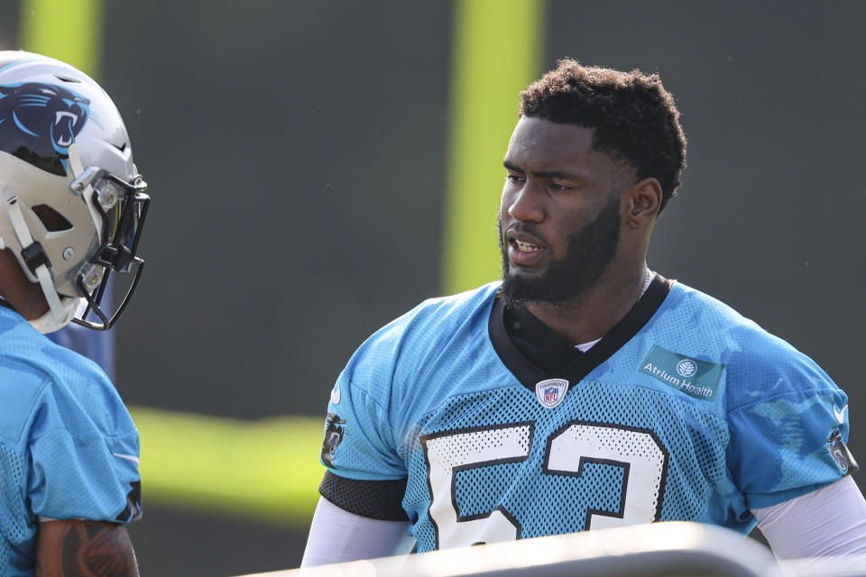 Carolina Panthers defensive end Brian Burns, right, talks to a teammate during practice at the NFL football team's training camp in Spartanburg, S.C., Thursday, July 29, 2021. (AP Photo/Nell Redmond)