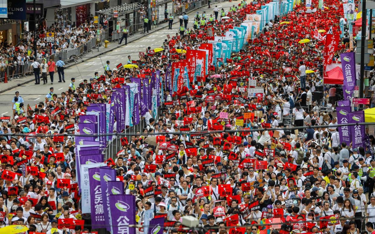 Protesters marching on June 9, 2019 during a rally against a controversial extradition law proposal in Hong Kong - AFP