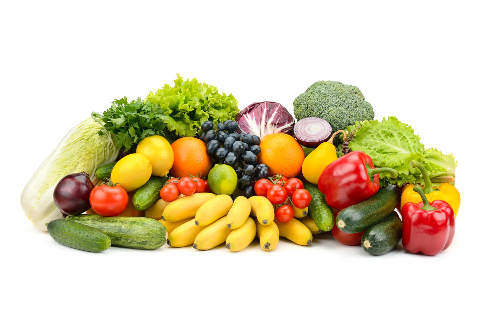 Different multi-colored healthy fruits and vegetables isolated on white background.