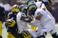 Colorado State wide receiver Melquan Stovall is tackled by the Michigan defense during the first half of an NCAA college football game, Saturday, Sept. 3, 2022, in Ann Arbor, Mich. (AP Photo/Carlos Osorio)