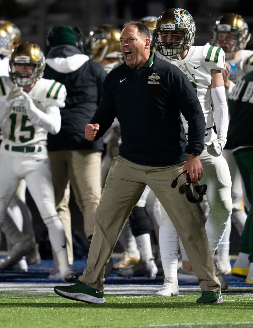 Westfield Shamrock head coach Jake Gilbert celebrates a turnover on downs Friday, Nov. 11, 2022, at Hamilton Southeastern High School in Fishers. 