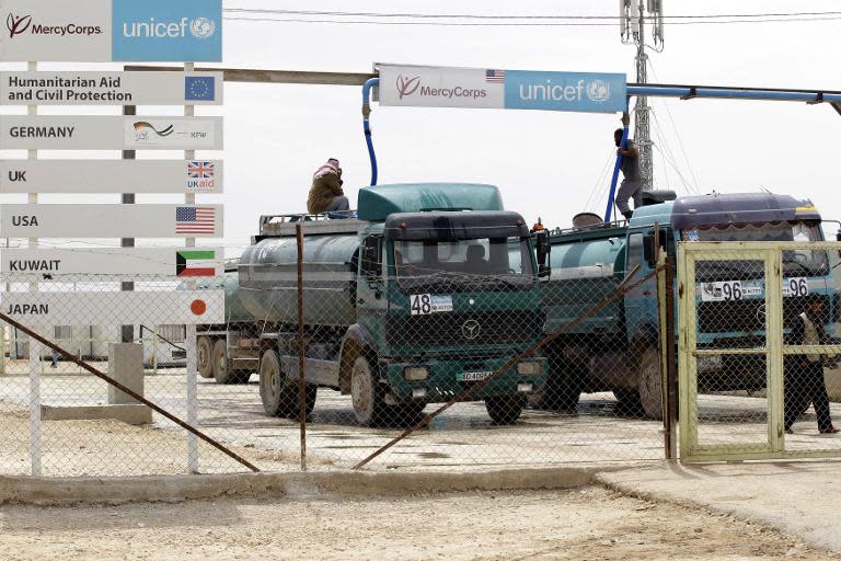 Tankers deliver clean water at the Zaatari Syrian refugee camp in Jordan, on April 15, 2014