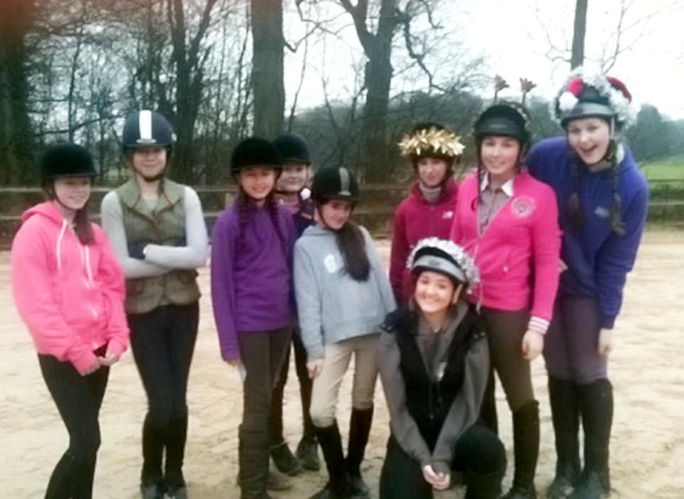 Turner towered over her classmates, pictured far right in a photo taken in 2012 with her friends at a horse riding day. (Kathryn Turner/SWNS)