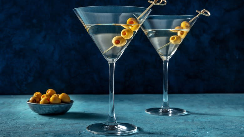 Two Martini cocktails garnished with olives