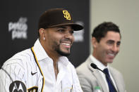 San Diego Padres' Xander Bogaerts, left, speaks as general manager A.J. Preller looks on at a news conference held to announce that Bogaerts' $280 million, 11-year contact with the Padres has been finalized, Friday, Dec. 9, 2022, in San Diego. (AP Photo/Denis Poroy)