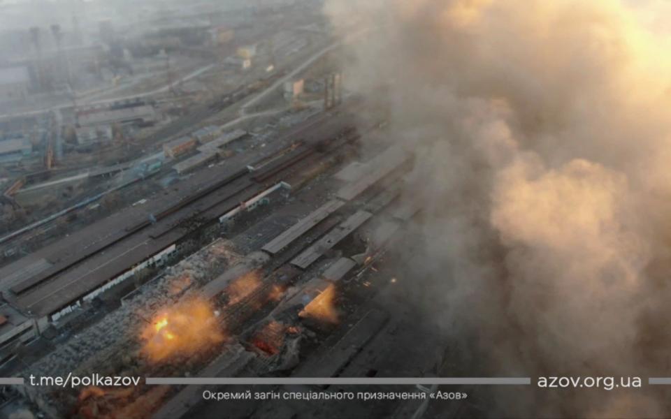 Multiple explosions and rising smoke are seen around an industrial compound in Mariupol - AZOV