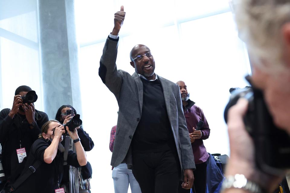 Georgia Sen. Raphael Warnock, D-Ga., gives a thumbs up to supporters before speaking at a Students for Warnock rally at Georgia Tech on Monday.