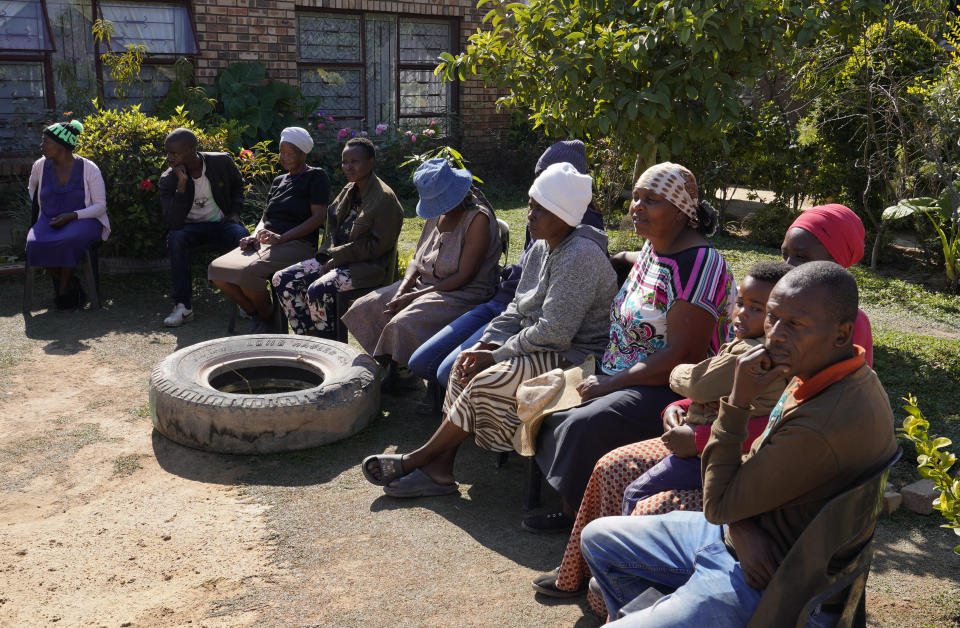 Residents gather at the home of Kaiser Letswalo in the Hammanskraal township, Pretoria, South Africa, Wednesday, May 22, 2024. THammanskraal’s problems are a snapshot of the issues affecting millions and driving a mood of discontent in South Africa that might force its biggest political change in 30 years in next week’s national election. (AP Photo/Denis Farrell)