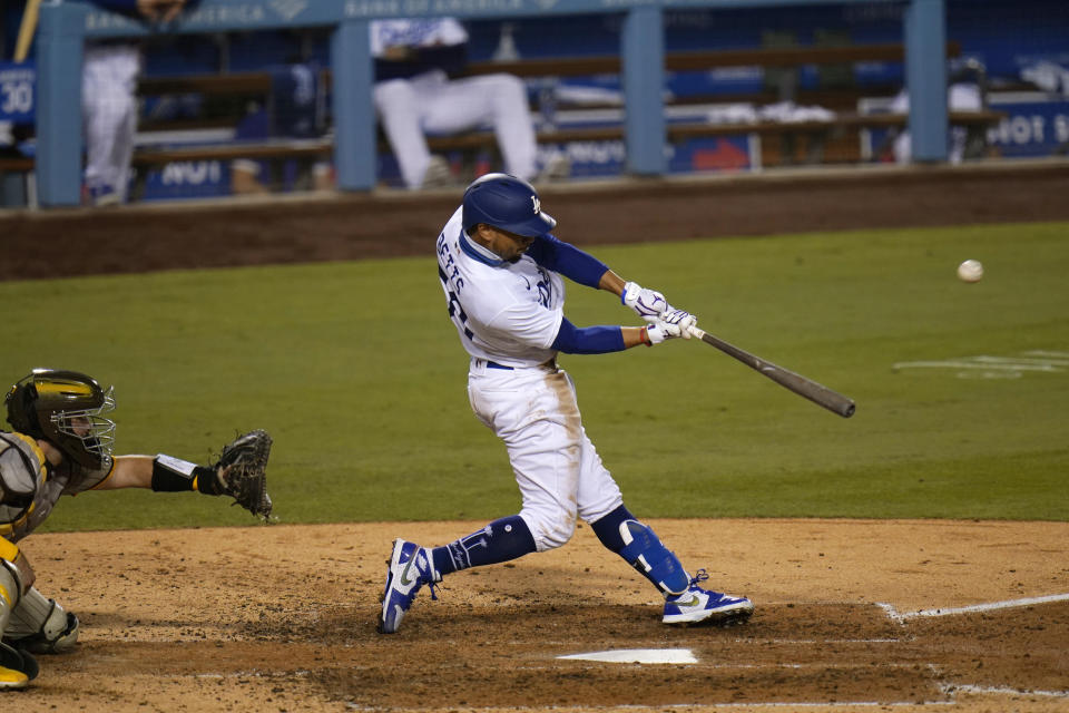 Los Angeles Dodgers' Mookie Betts hits his third home run of a baseball game during the fifth inning against the San Diego Padres, Thursday, Aug. 13, 2020, in Los Angeles. (AP Photo/Jae C. Hong)