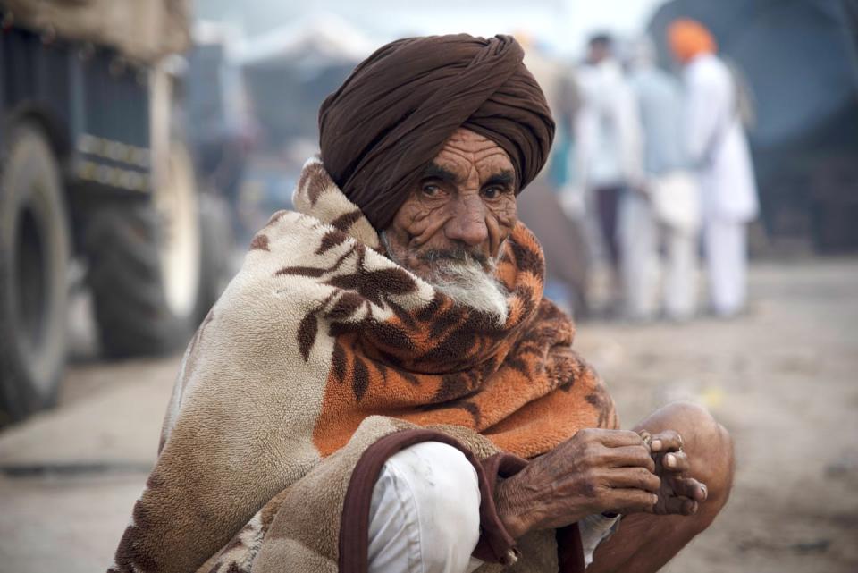 Chronic unprotected sun exposure can damage skin, with effects that look like those on this farmer in India. <a href="https://commons.wikimedia.org/wiki/File:2020_Indian_farmers%27_protest_-_old_man_sitting.jpg" rel="nofollow noopener" target="_blank" data-ylk="slk:Randeep Maddoke/Wikimedia Commons;elm:context_link;itc:0;sec:content-canvas" class="link ">Randeep Maddoke/Wikimedia Commons</a>, <a href="http://creativecommons.org/licenses/by/4.0/" rel="nofollow noopener" target="_blank" data-ylk="slk:CC BY;elm:context_link;itc:0;sec:content-canvas" class="link ">CC BY</a>