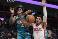 Houston Rockets forward Kenyon Martin Jr. (6) loses control of the ball next to Detroit Pistons forward Saddiq Bey (41) during the second half of an NBA basketball game, Saturday, Jan. 28, 2023, in Detroit. (AP Photo/Carlos Osorio)