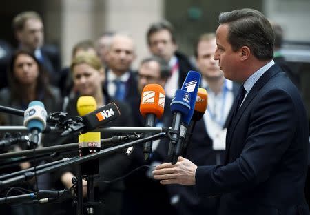 British Prime Minister David Cameron talks to the media as he arrives for a European Union leaders summit addressing the talks about the so-called Brexit and the migrants crisis in Brussels, Belgium, February 18, 2016. REUTERS/Dylan Martinez