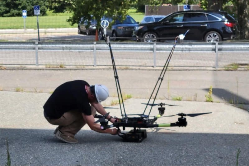 Electronic Systems Engineer Jake Revesz preps the Alta X Uncrewed Aircraft System for flight ahead the solar eclipse Monday in Fort Drum, N.Y. Photo by Jen Fowler/NASA