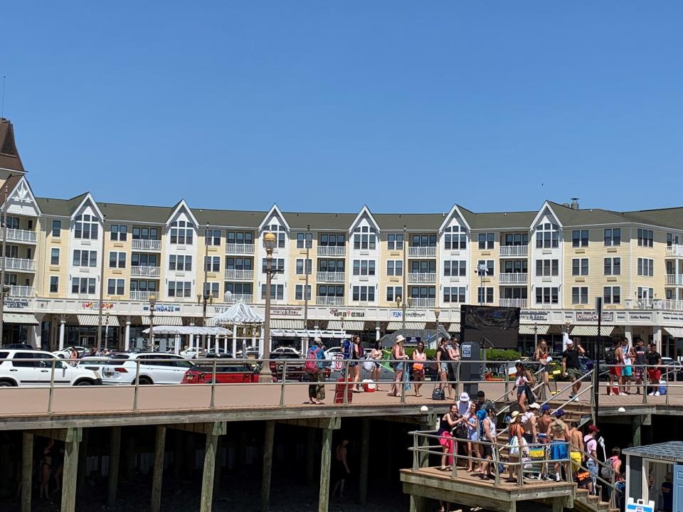 Beachgoers get their beach badges and go down to the beach at Pier Village in Long Branch.