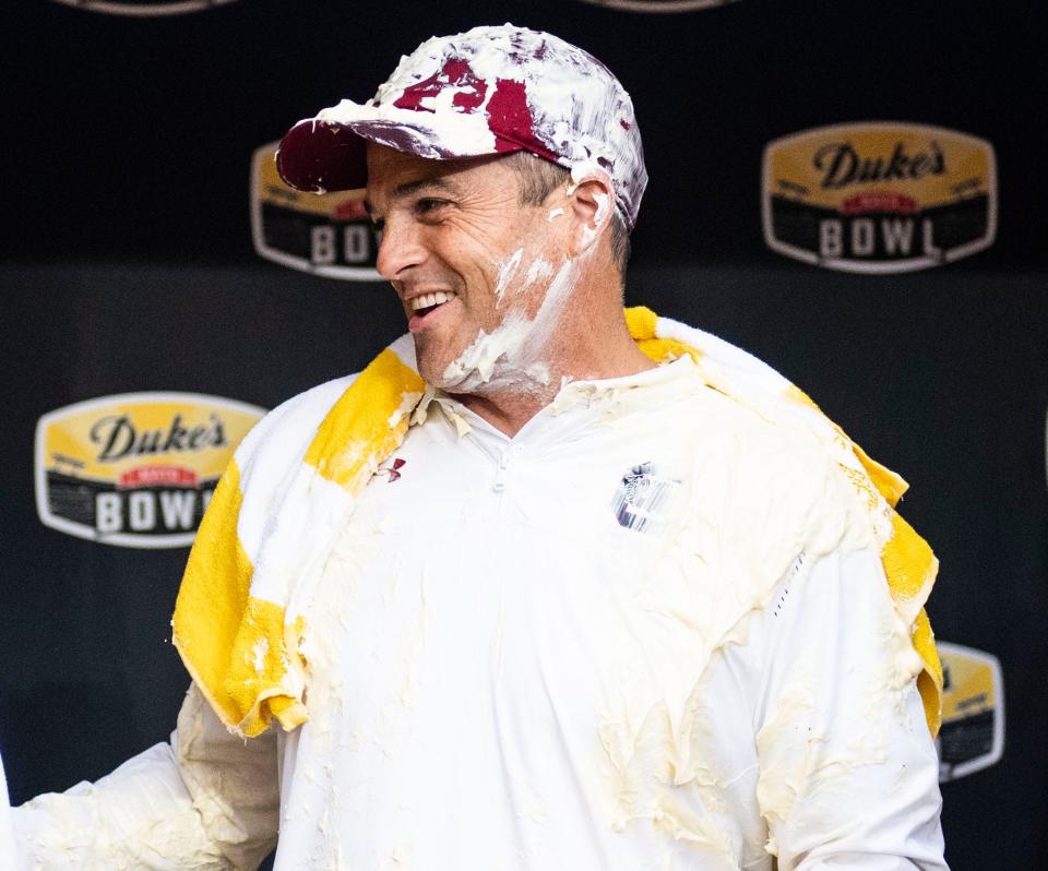 South Carolina Gamecocks coach Shane Beamer gets interviewed after getting Duke's Mayo poured on him after beating the North Carolina Tar Heels in the Duke's Mayo Bowl at Bank of America Stadium in Charlotte on Thursday, December 30, 2021.