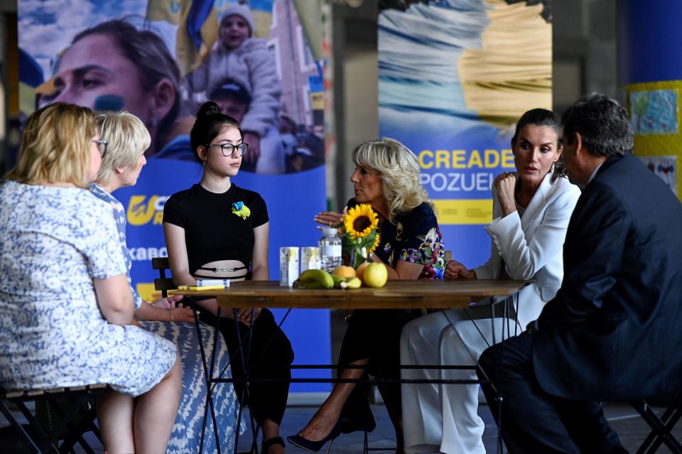 Spain's Queen Letizia (2nd R) and U.S. first lady Jill Biden (center) speak with members of a family from Ukraine during a visit to a reception centre for Ukrainian refugees in Pozuelo de Alarcon, near Madrid, on the sidelines of a NATO summit, on June 28, 2022. / Credit: OSCAR DEL POZO/POOL/AFP via Getty Images