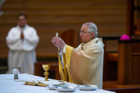 Archbishop Jose H. Gomez celebrates the the Solemnity of the Most Holy Trinity, a Mass with churchgoers present at the Cathedral of Our Lady of the Angels in downtown Los Angeles on Sunday, June 7, 2020. It was his first Mass since public Masses throughout the Archdiocese of Los Angeles were suspended nearly three months ago on March 16 amid the COVID-19 pandemic. Attendance at the Mass is limited to 100 people only, on a first come, first served basis, following the social guidelines and regulations set by the LA County Health Department and the Archdiocese. (AP Photo/Damian Dovarganes)