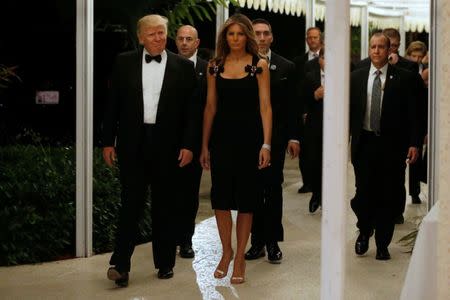 U.S. President-elect Donald Trump and his wife Melania Trump arrive for a New Year's Eve celebration with members and guests at the Mar-a-lago Club in Palm Beach, Florida, U.S. December 31, 2016. REUTERS/Jonathan Ernst