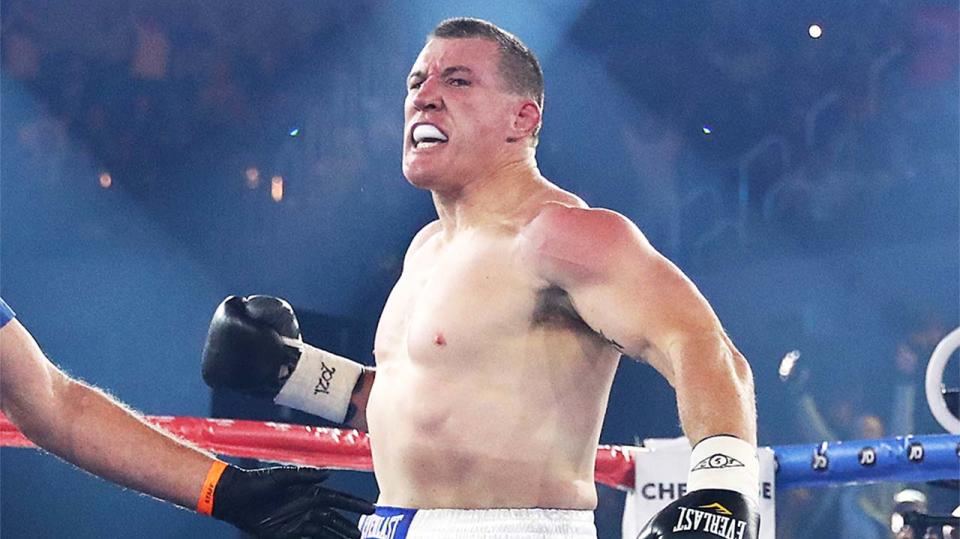 Paul Gallen (pictured) celebrates after winning a boxing fight.