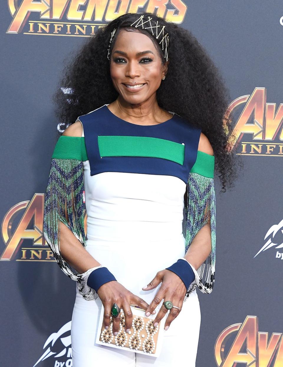 <p>Use multiple bobby pins to keep curls out of your face and look avant-garde stylish at the same time, like actress Angela Bassett. </p>
