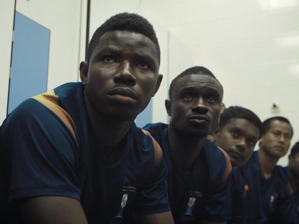 The film follows a group of migrant workers in Qatar (The Workers Cup LLC)