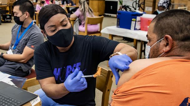 PHOTO: Nurse Francemene Henry administers the Pfizer vaccine at Arlington High School, Sept. 22, 2021 in Riverside, Calif. (Gina Ferazzi/Los Angeles Times via Getty Images)