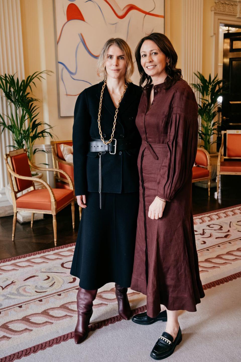 a couple of women posing for the camera