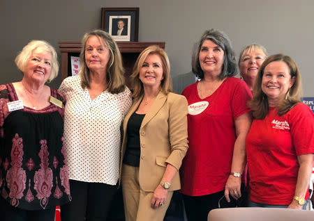 U.S. Republican Marsha Blackburn poses with volunteers for her campaign for the U.S. Senate in Shelby County in suburban Memphis, Tennessee, U.S., October 3, 2018. REUTERS/Sharon Bernstein