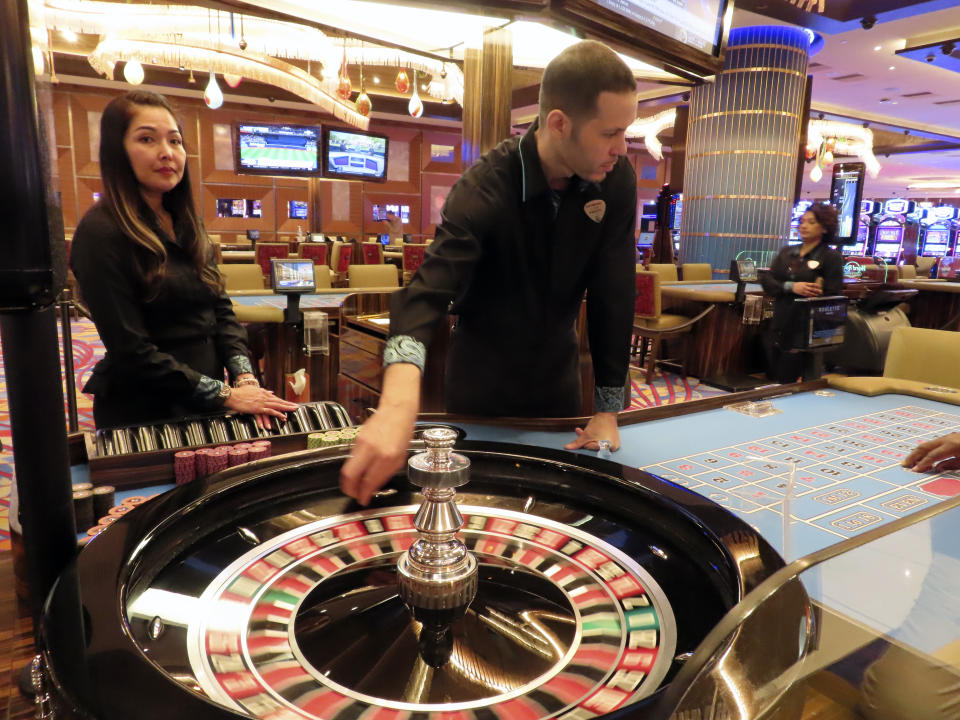 Dealers conduct a game of roulette at the Hard Rock casino in Atlantic City, N.J., on May 17, 2023. On July 14, New Jersey gambling regulators released figures showing that Atlantic City's nine casinos, the three horse tracks that take sports bets and their online partners won over $457 million in June, an increase of 13.9% from a year earlier. (AP Photo/Wayne Parry)