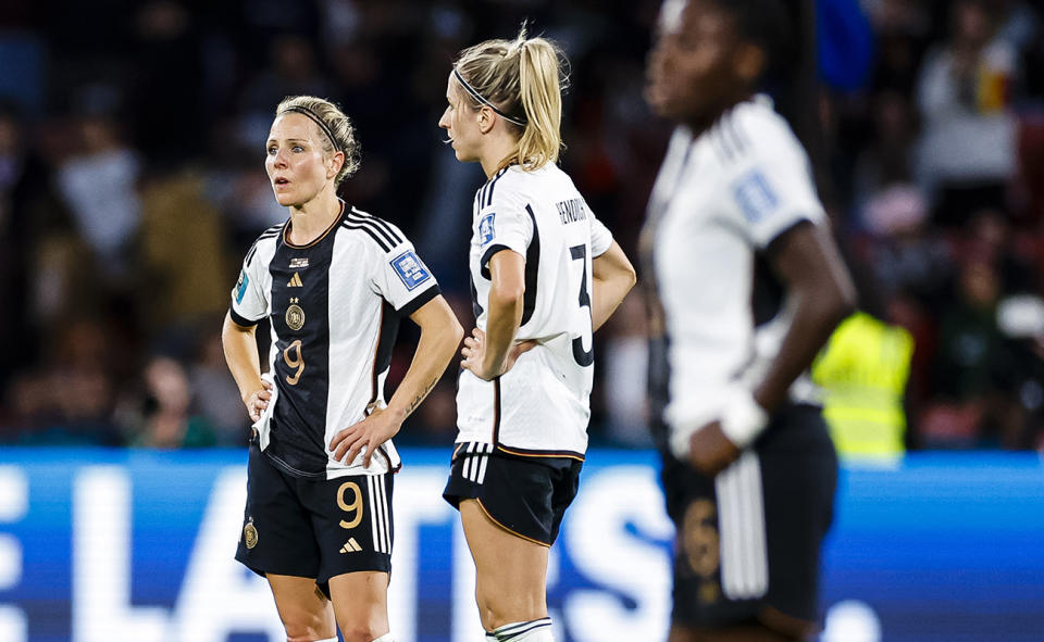 Germany players look on in shock after being eliminated from the Women's World Cup.