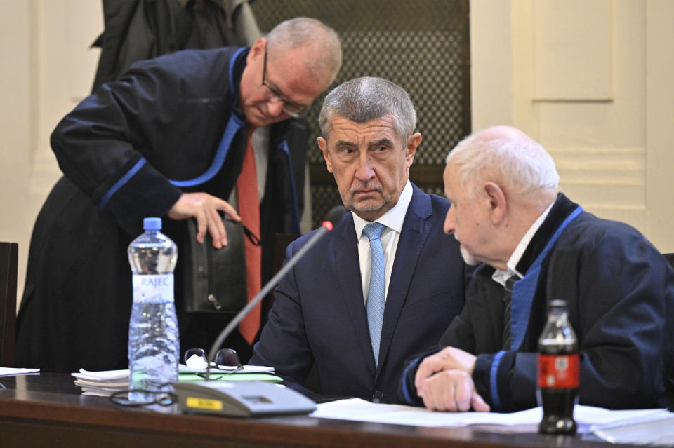 Former prime minister Andrej Babis, center, at the Prague Municipal Court in Prague. Czech Republic, Monday, Sept. 12, 2022. Babis goes on trial after the prosecution indicted him in a $2 million fraud case involving European Union subsidies. (Vit Simanek/CTK via AP).