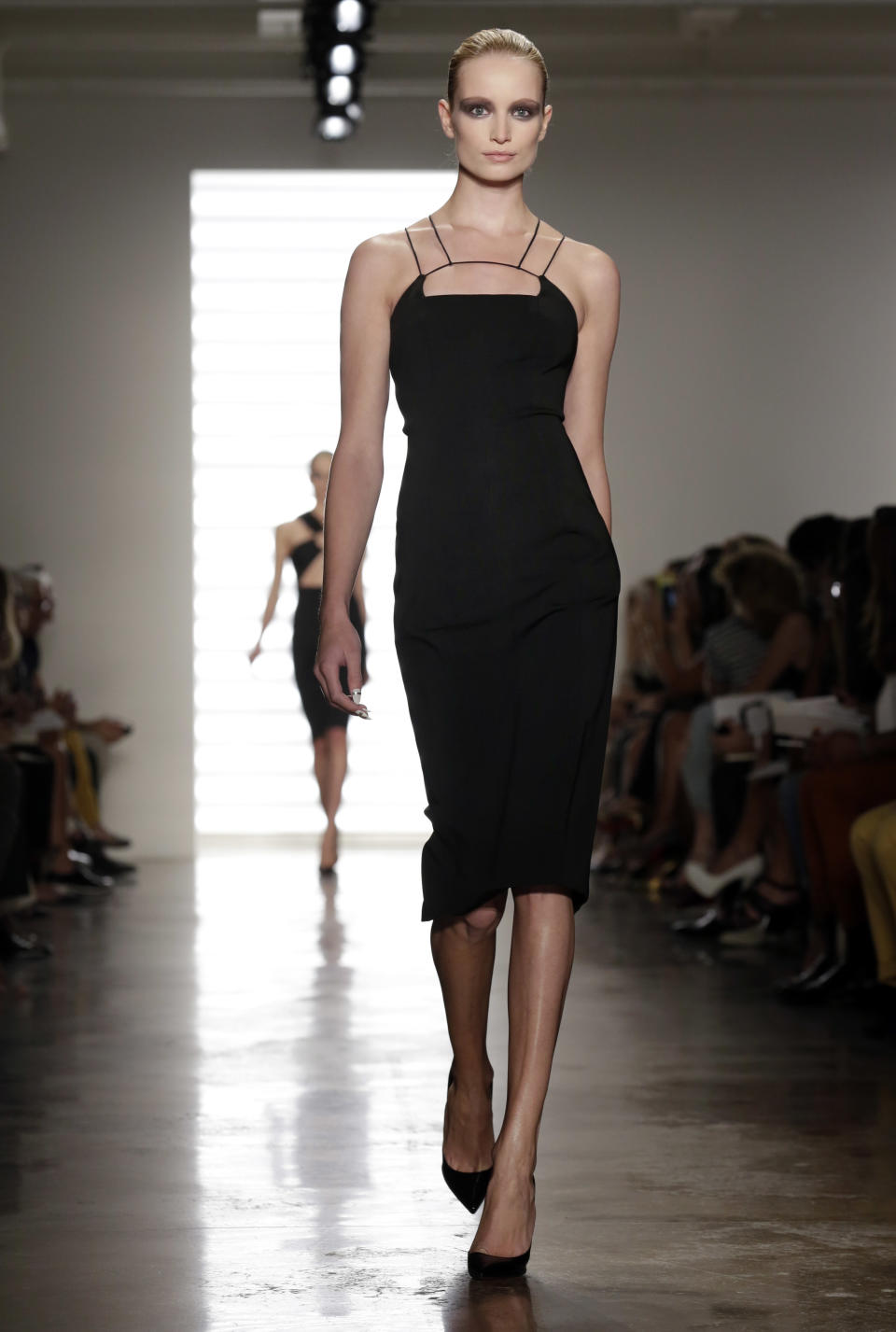 The Cushnie et Ochs Spring 2014 collection is modeled during Fashion Week in New York, Friday, Sept. 6, 2013. (AP Photo/Richard Drew)