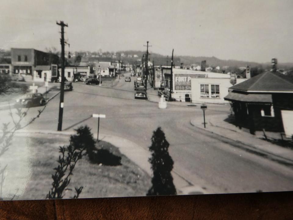 In this picture from around the time of the incident, you can see the site of the infamous 1941 bank robbers' shootout with police in the borough. The dark building on the right is the Red Hot hot dog shop. The white building opposite was Mallory's News Stand. Between the two is the Fifth Avenue Bridge intersecting with Wampum Avenue.