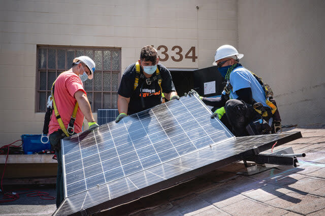 Students in the solar portion of the L.A. County Skilled Trades Summers program learn how to mount solar panels on roofs in classrooms first, as shown here from last summer, before they join professionals and help put them on real roofs. (Ben Gibbs/Harbor Freight Tools for Schools)