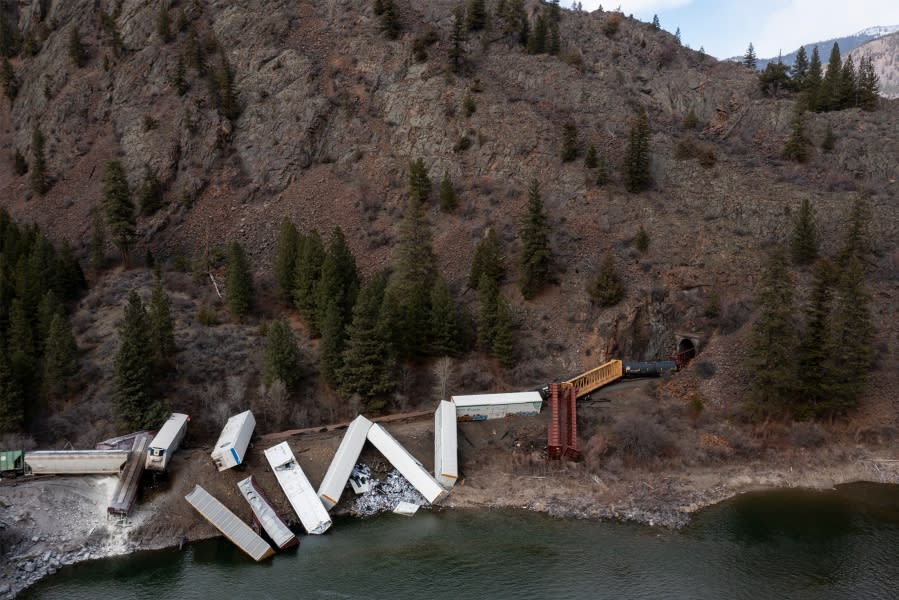 A train sits derailed near Quinn’s Hot Springs Resort west of St. Regis, Mont., Sunday, April 2, 2023. Montana Rail Link is investigating the derailment in which there were no injuries reported. (Ben Allan Smith/The Missoulian via AP)