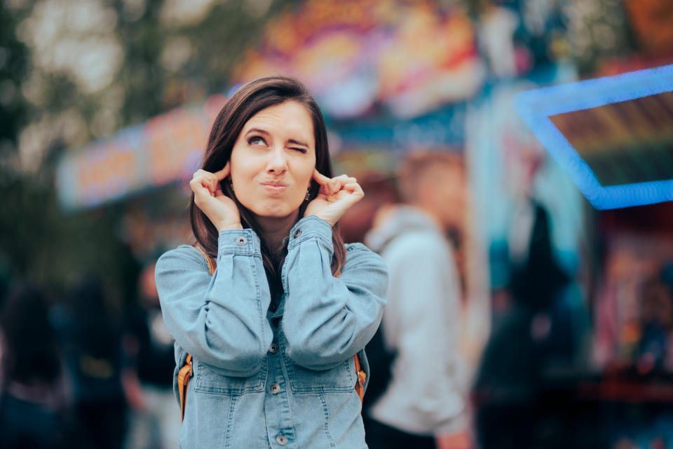 Stressed woman frustrated and annoyed with the unbearable noise. Up to 1.35 billion young people are at risk of losing their hearing due to loud noise exposure, according to a study. (Getty)