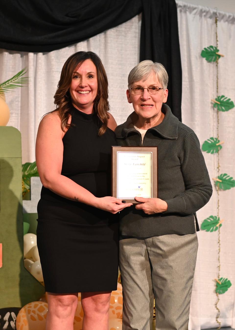 Jennifer Vincent presented Stevie Fairchild with the 2024 Community Impact Award.