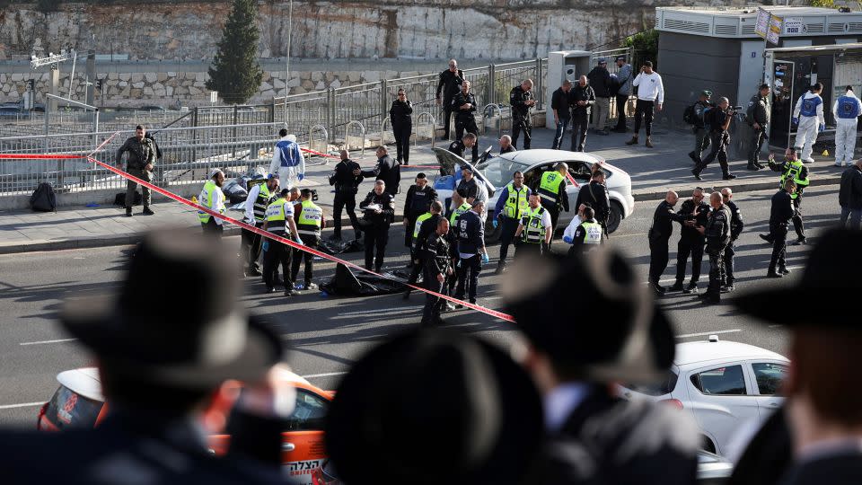 Israeli officials work at the scene of the attack. - Ronen Zvulun/Reuters